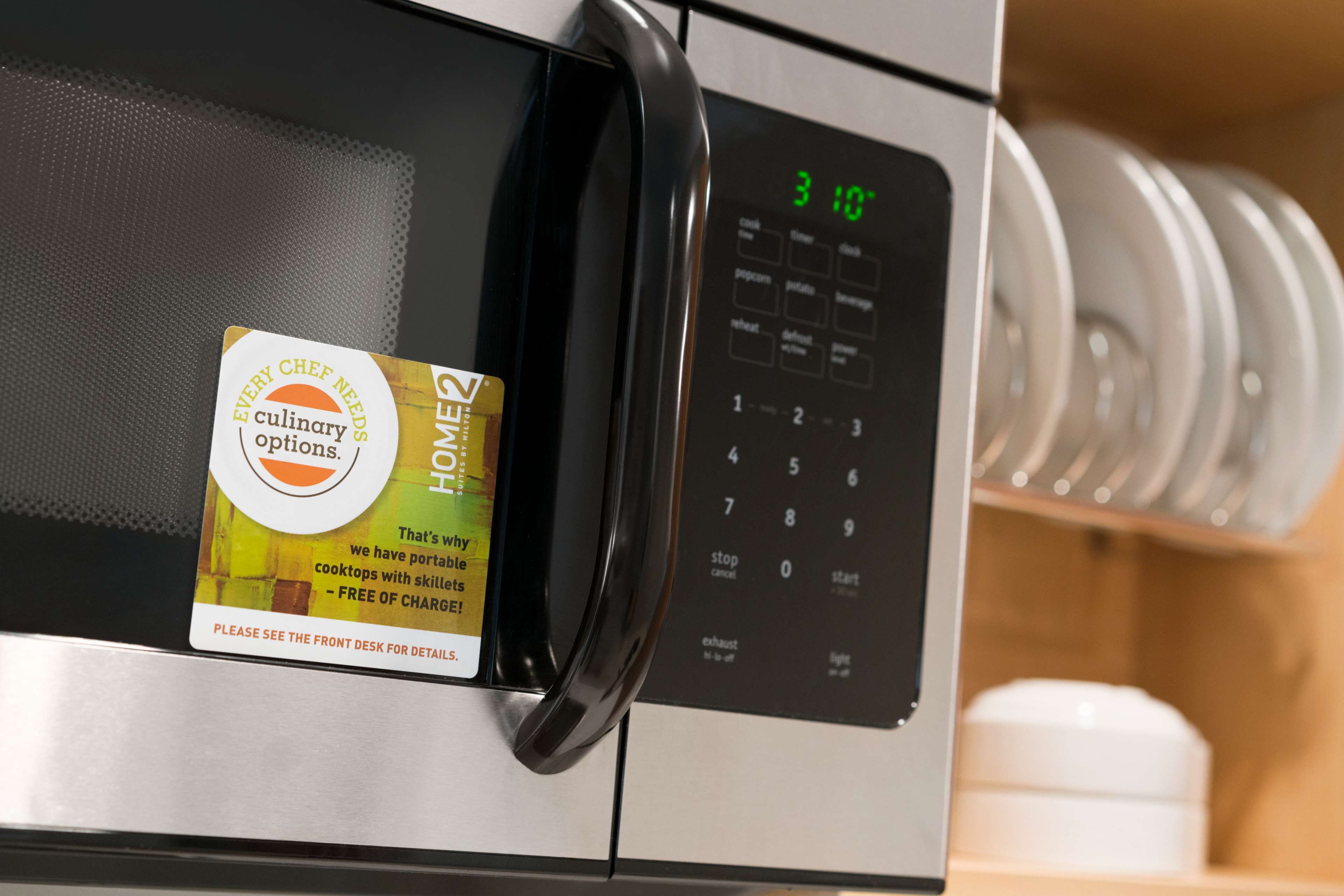 full-sized fridge, microwave, dishwasher, cookware/dishes/utensils