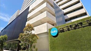 A modern building with a sign that reads "Guild." - StayCentral - NGV Arts Centre Retreat (Southbank)