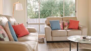 Waterfront Holiday Home - Esplanade 54 | Living area | Flat-screen TV, DVD player