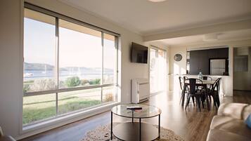 Waterfront Holiday Home - Esplanade 54 | Living area | Flat-screen TV, DVD player