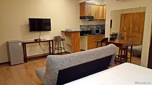 Studio Suite | Living area | Flat-screen TV - Golden Gate Suites (Dumaguete)