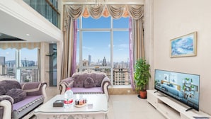 Suite Deluxe, 1 habitación | Área de sala de estar