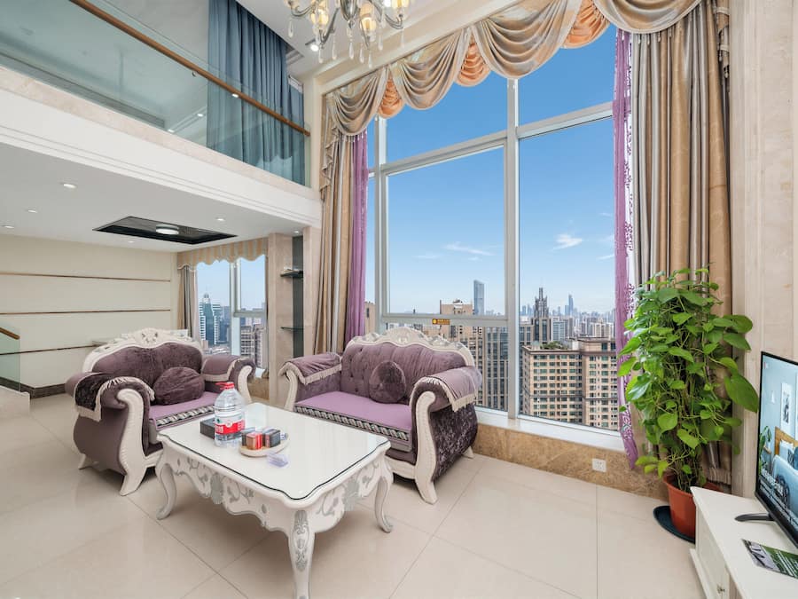 Duplex Deluxe Two-bedroom Suite | Living area | 40-inch TV with cable channels
