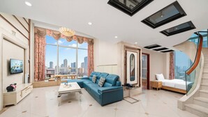 Suite Deluxe, 3 habitaciones | Área de sala de estar
