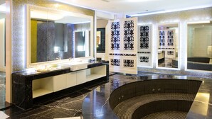A modern bathroom with a large mirror, black marble countertops, and a black and white patterned wall. - All-Ur Boutique Motel - Tai-Chung Branch (Taichung)