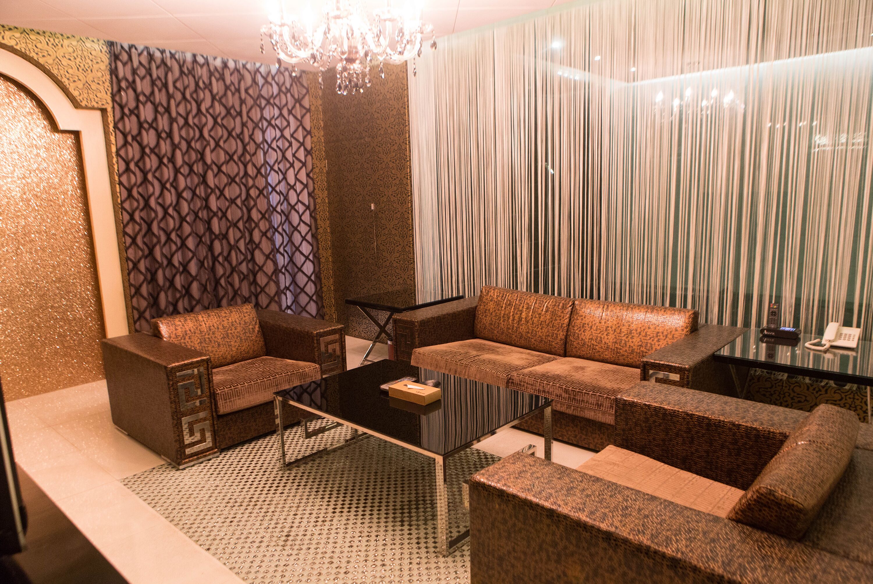 flagship suite check in time starts from 6pm karaoke in room | living area | lcd tv