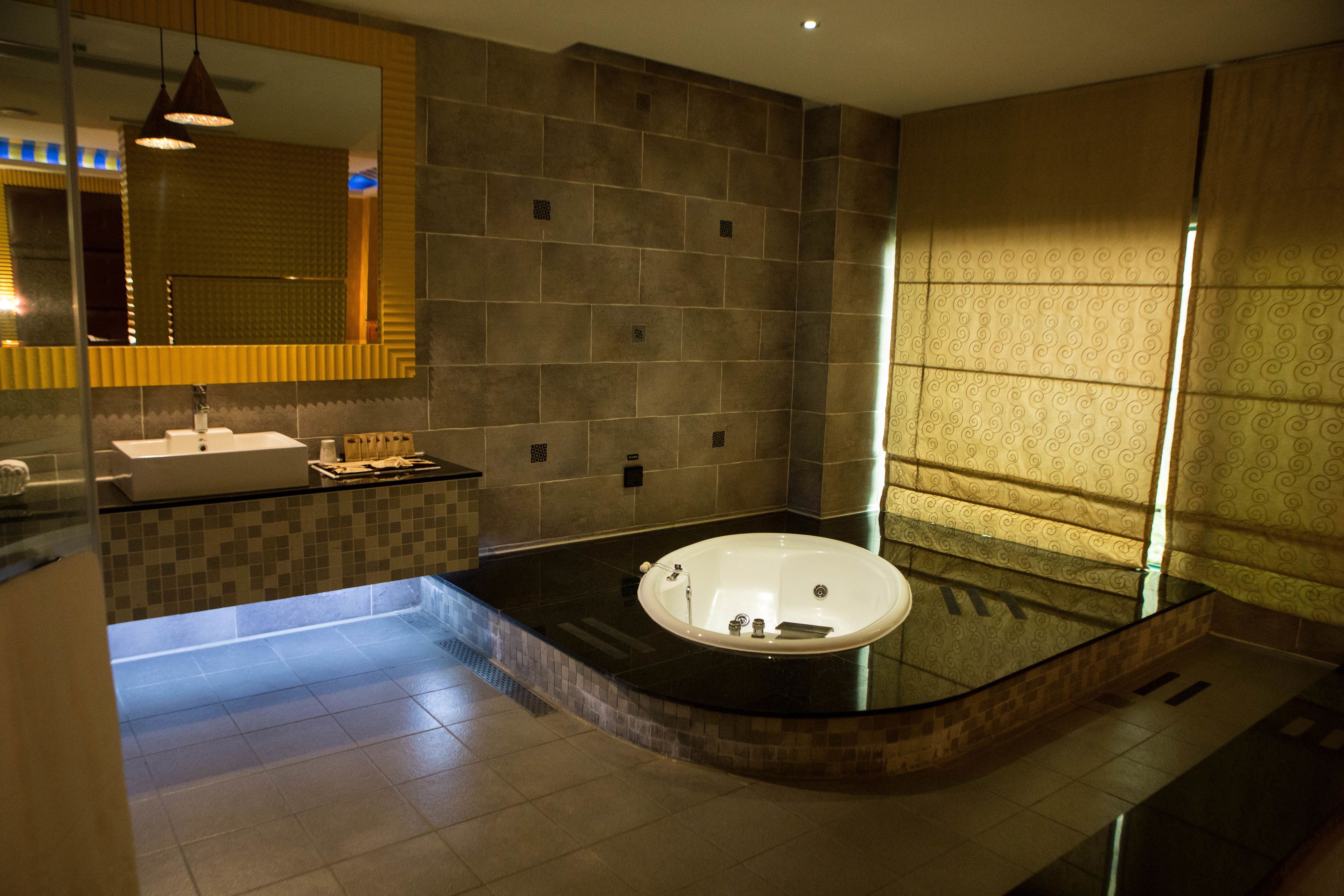 standard suite | bathroom | separate bathtub and shower, free toiletries, hair dryer, slippers