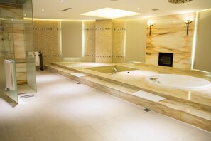 A modern bathroom with a large bathtub, a glass shower enclosure, and a marble-tiled wall. - All-Ur Boutique Motel - Chang-Hua Branch (Changhua)