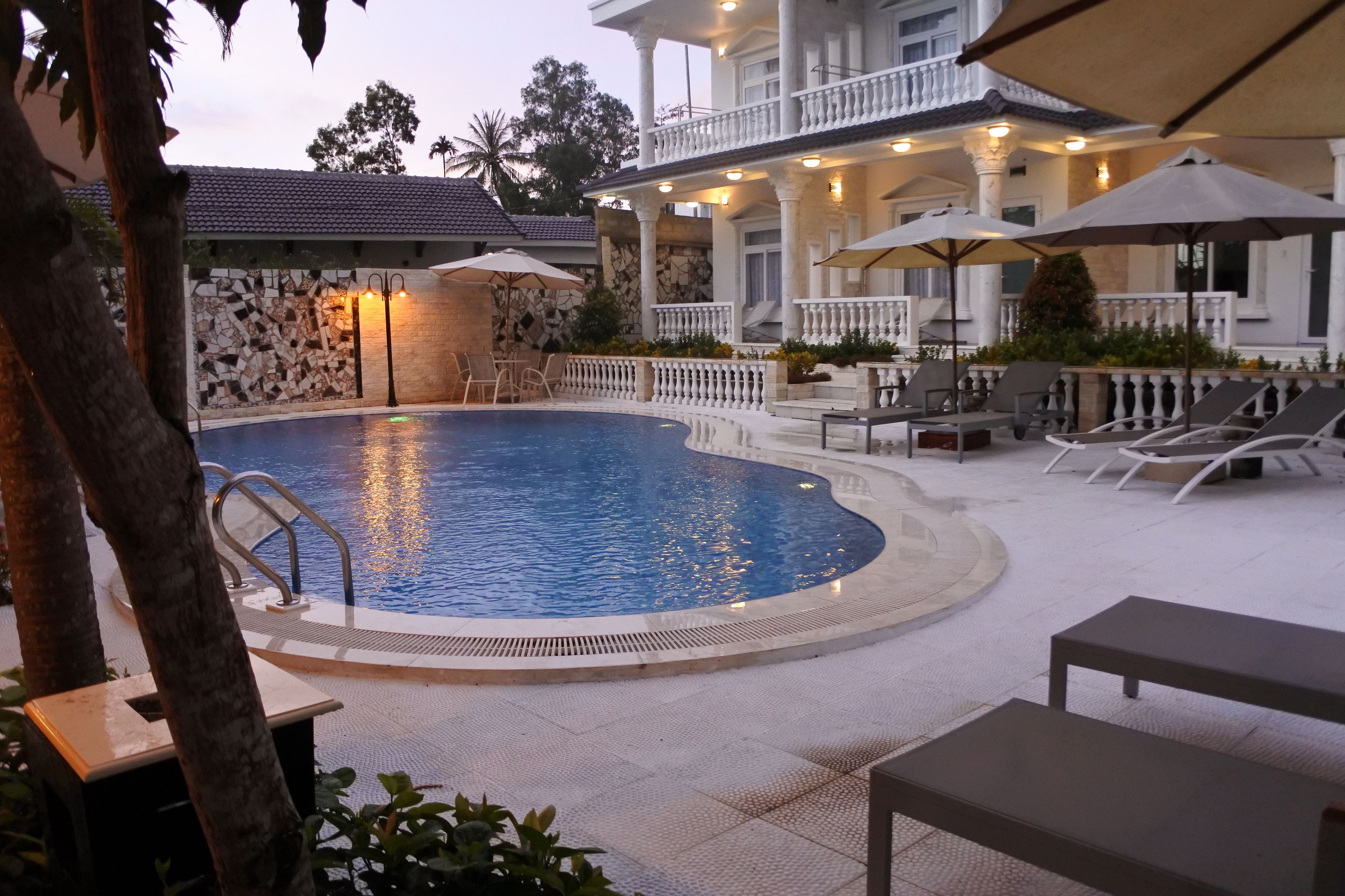 outdoor pool, pool umbrellas, pool loungers