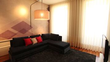 Superior Apartment, 1 Bedroom | Living room | 40-inch flat-screen TV with cable channels, TV