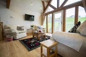 Appartamento, 2 camere da letto | Area soggiorno | TV a schermo piatto