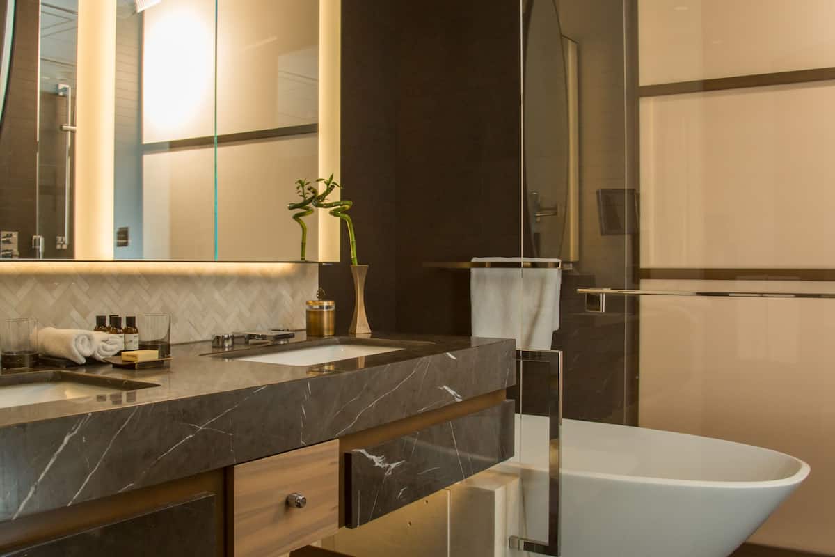 combined shower/bathtub, rainfall showerhead, designer toiletries