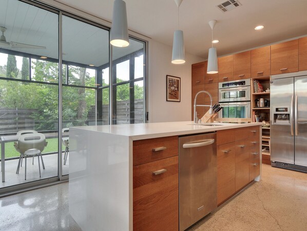 Full-size fridge, microwave, oven, stovetop - Modernly Designed Austin Home by RedAwning (Austin)