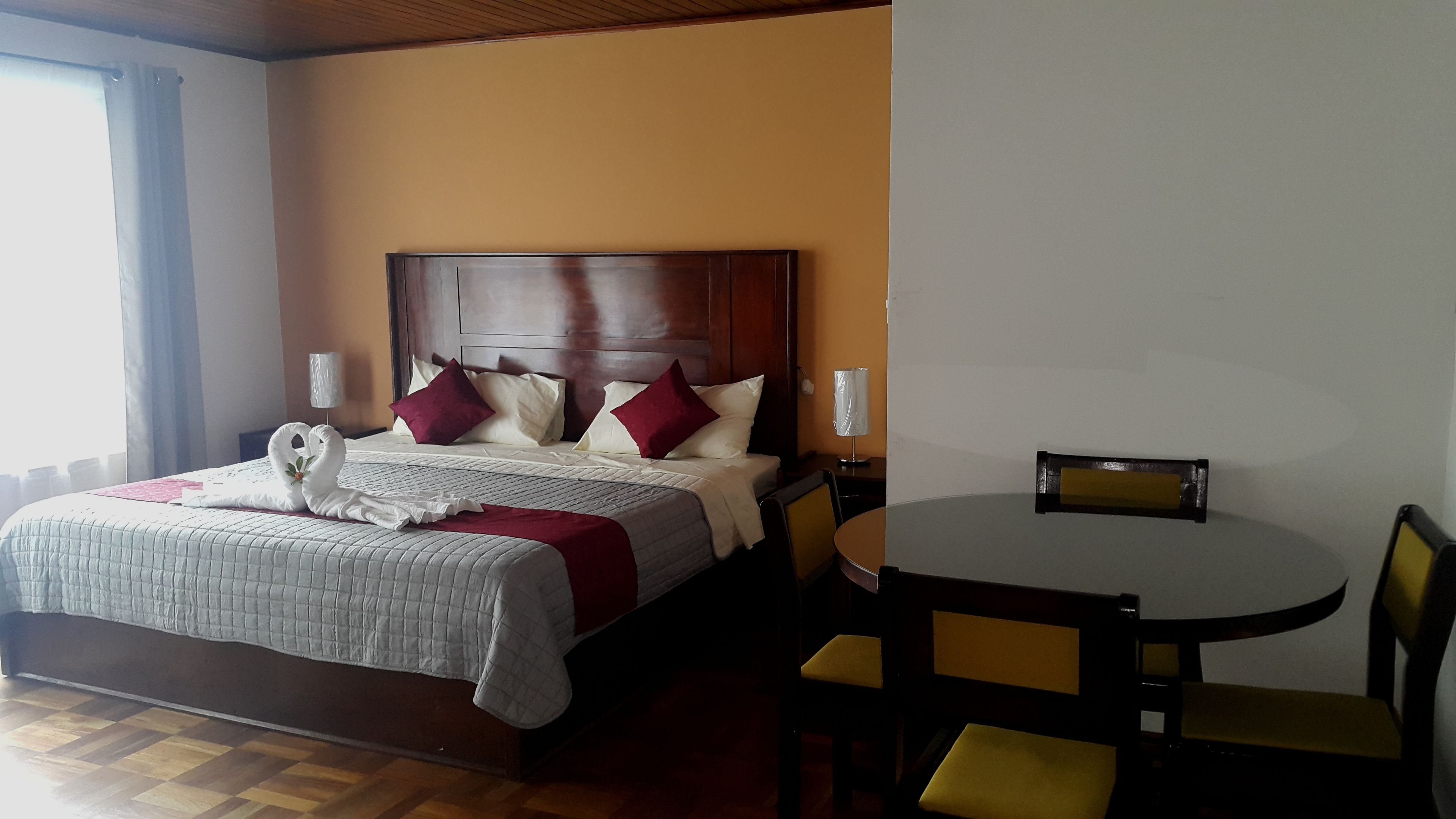 exclusive suite, 1 king bed, poolside | in-room safe, desk, iron/ironing board, free wifi