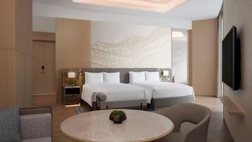 A modern hotel room with two beds, a flat-screen TV, a round table with a plant, and a stone-patterned wall.