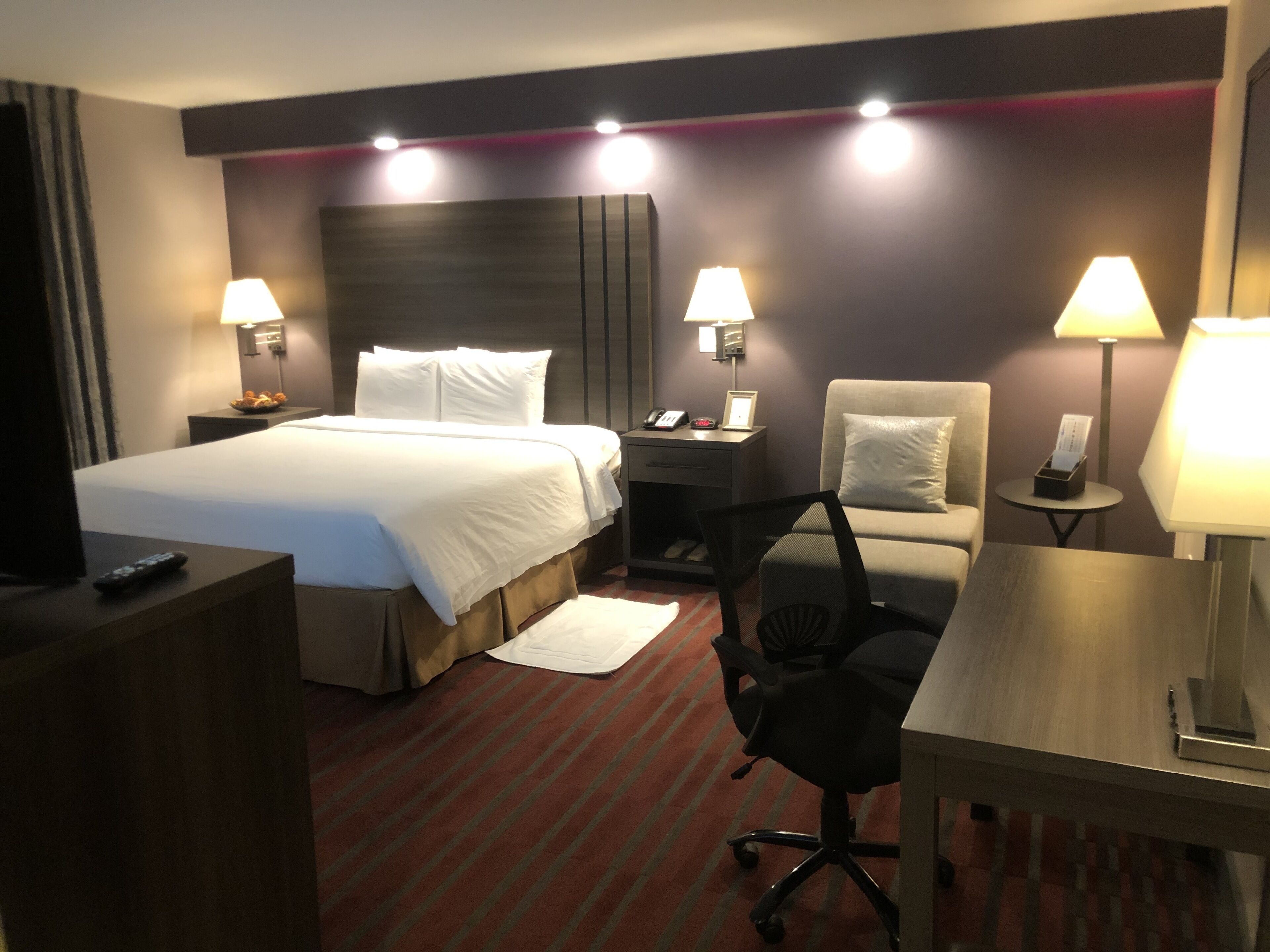 luxury room, 1 king bed, non smoking, jetted tub | premium bedding, desk, blackout curtains, iron/ironing board