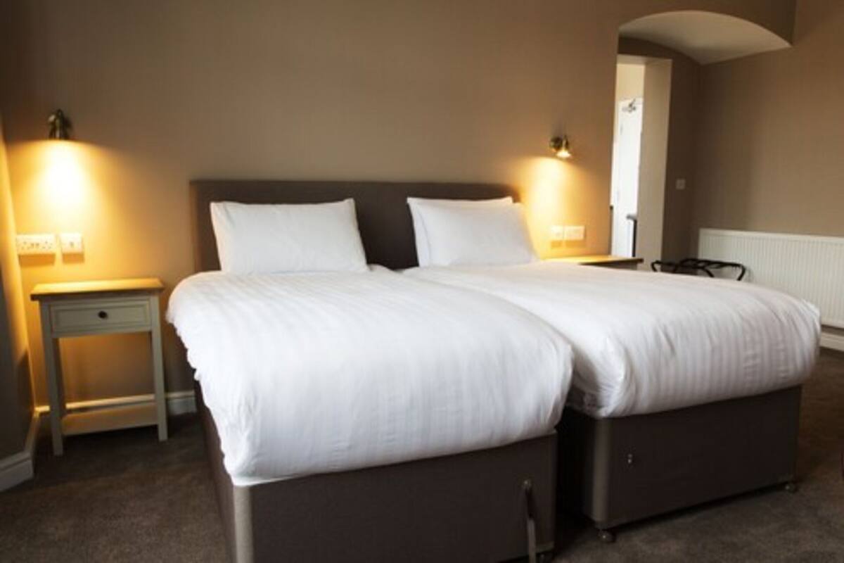 Premium bedding, pillowtop beds, desk, laptop workspace