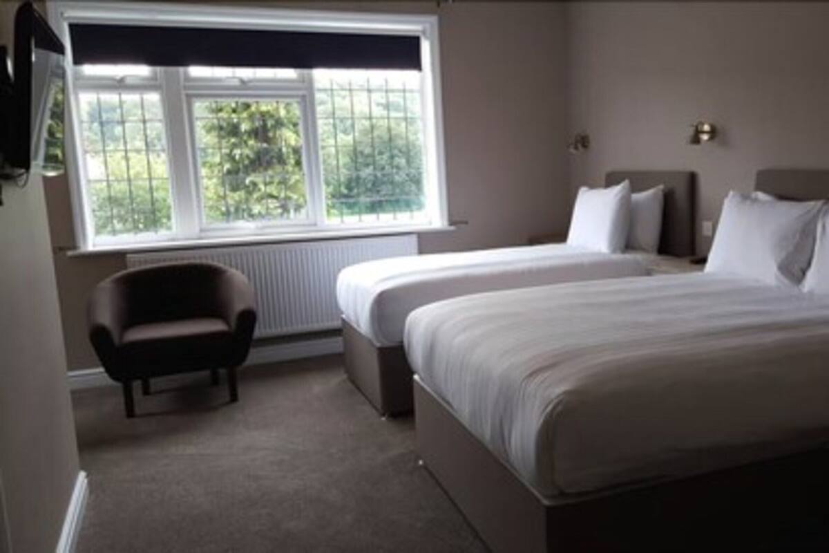 Premium bedding, pillowtop beds, desk, laptop workspace