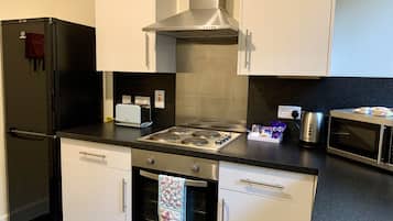 Fridge, oven, electric kettle, cookware/dishes/utensils