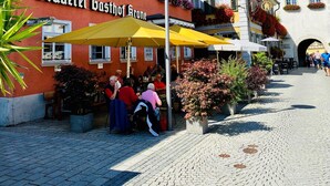 A building with a sign reading "Brauerei Gasthof Grone" and outdoor seating with umbrellas. - Brauerei Gasthof Krone (Tettnang)