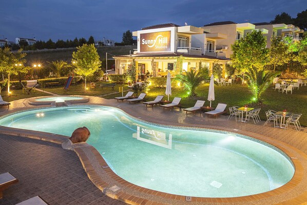 Outdoor pool, pool umbrellas, pool loungers