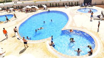 3 outdoor pools, pool umbrellas, pool loungers