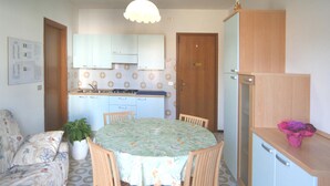 Apartment, 1 Bedroom | Living room | Flat-screen TV - Burello (Lignano Sabbiadoro)