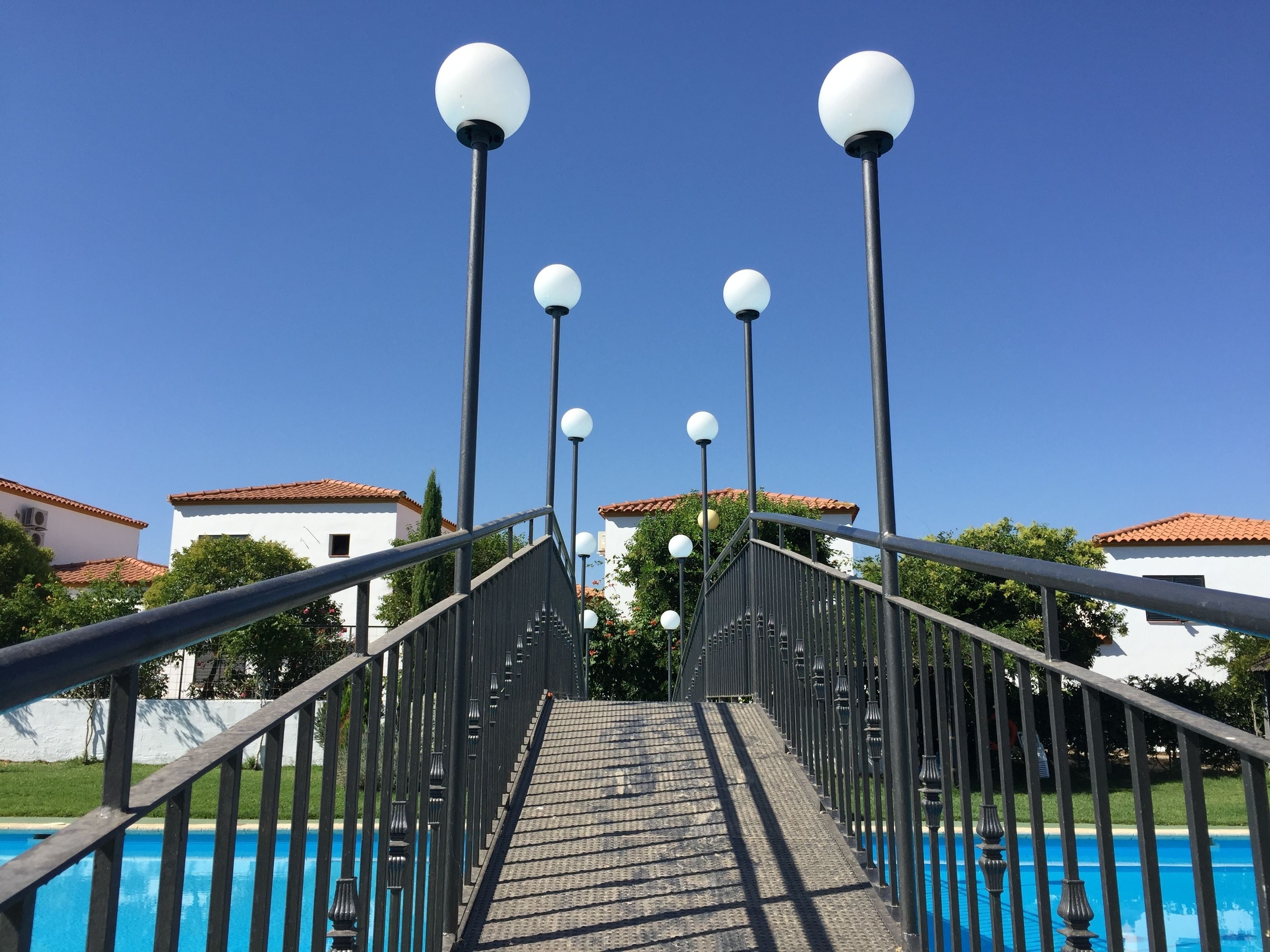 Outdoor pool, open noon to 9 PM, pool umbrellas