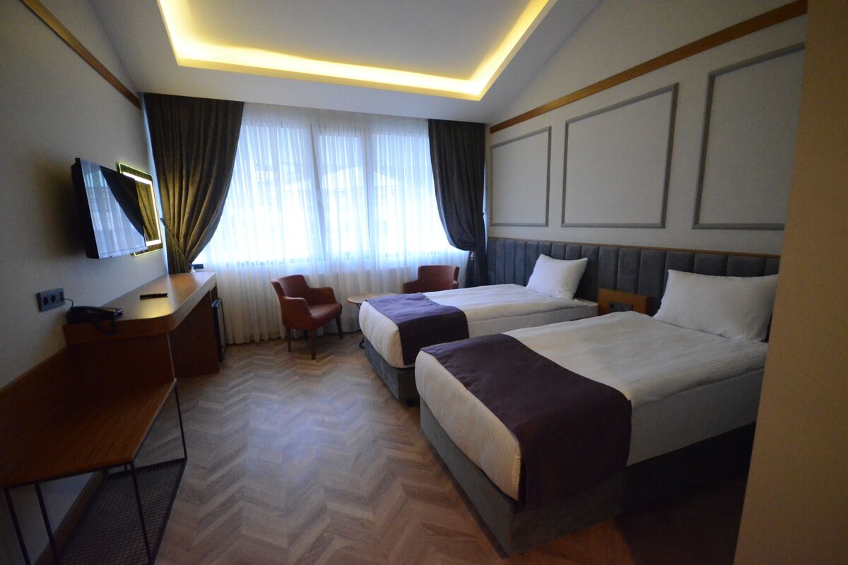 Family Quadruple Room | Minibar, in-room safe, WiFi (free), individually decorated