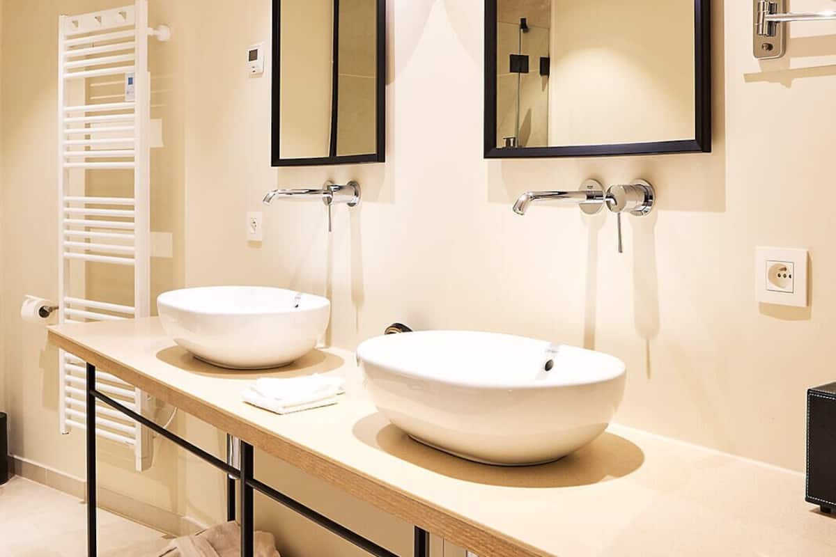 luxury suite | bathroom | free toiletries, hair dryer, slippers, towels