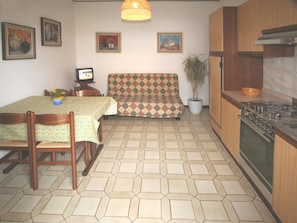 Apartment, 1 Bedroom | Private kitchen | Full-sized fridge, microwave, stovetop, cookware/dishes/utensils