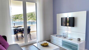 Exclusive Apartment, 2 Bedrooms, Terrace, Sea View | Living area | Flat-screen TV
