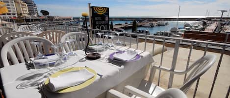 Breakfast, lunch, dinner served; local cuisine, alfresco dining