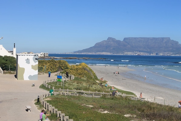 Beach nearby, white sand, beach shuttle, 5 beach bars