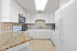 Condo, 1 King Bed with Sofa bed (Phoenix X Unit 602) | Private kitchen | Fridge, microwave, coffee/tea maker