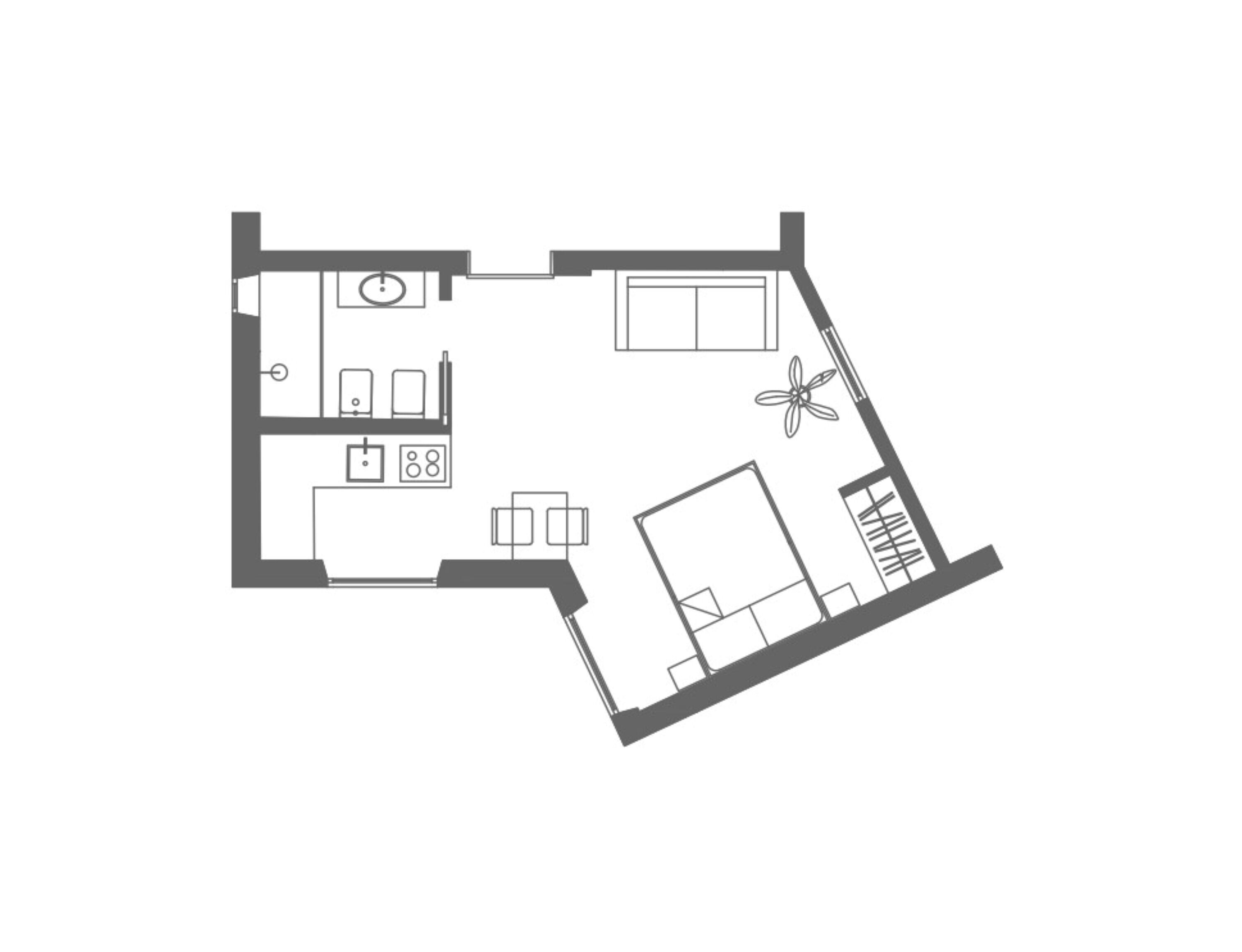 A floor plan of a hotel room with a bed, a desk, a chair, a small table, and a window.