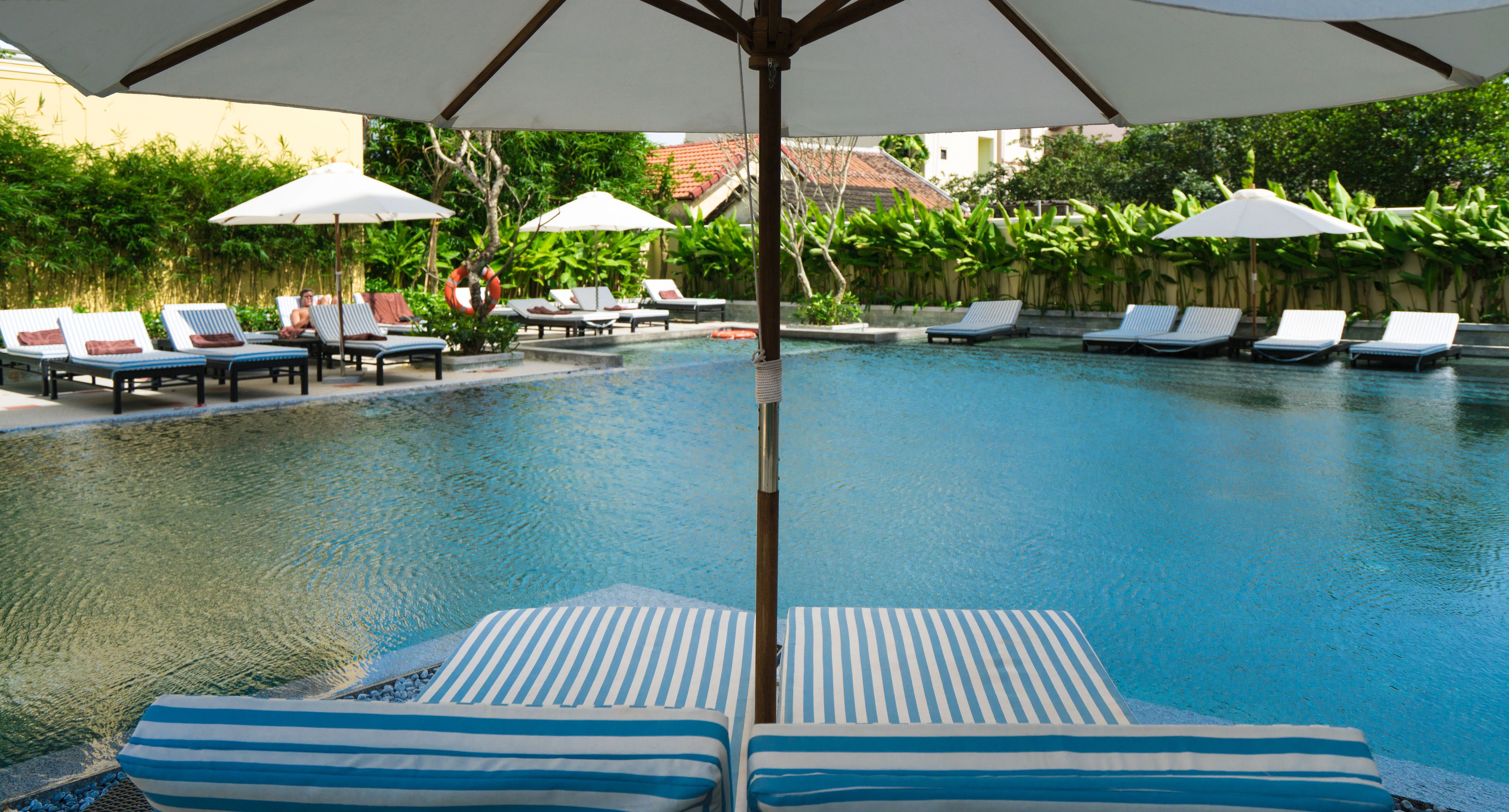 outdoor pool, pool umbrellas, pool loungers