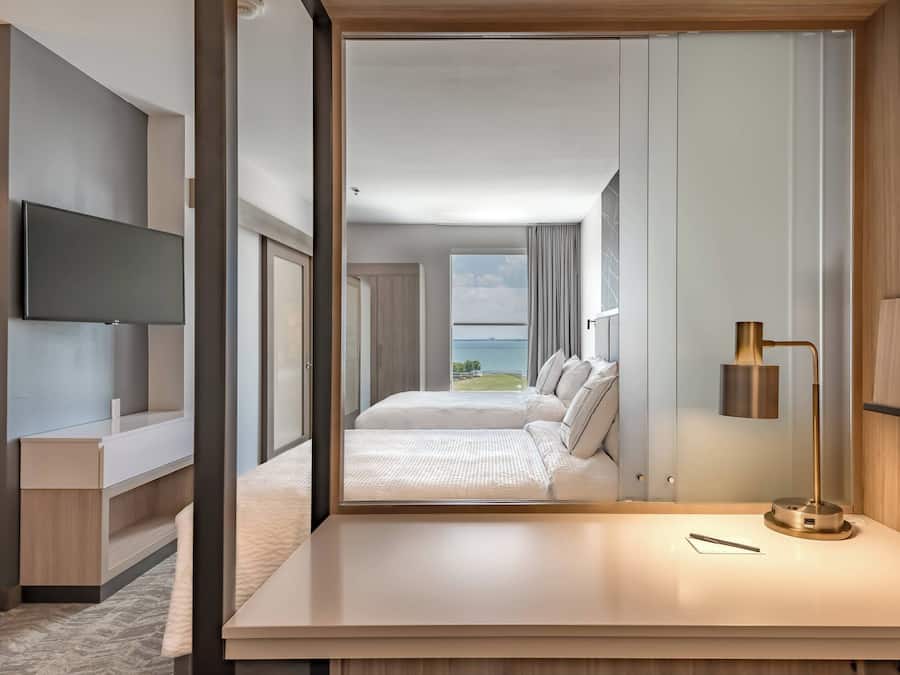 Premium bedding, desk, laptop workspace, iron/ironing board