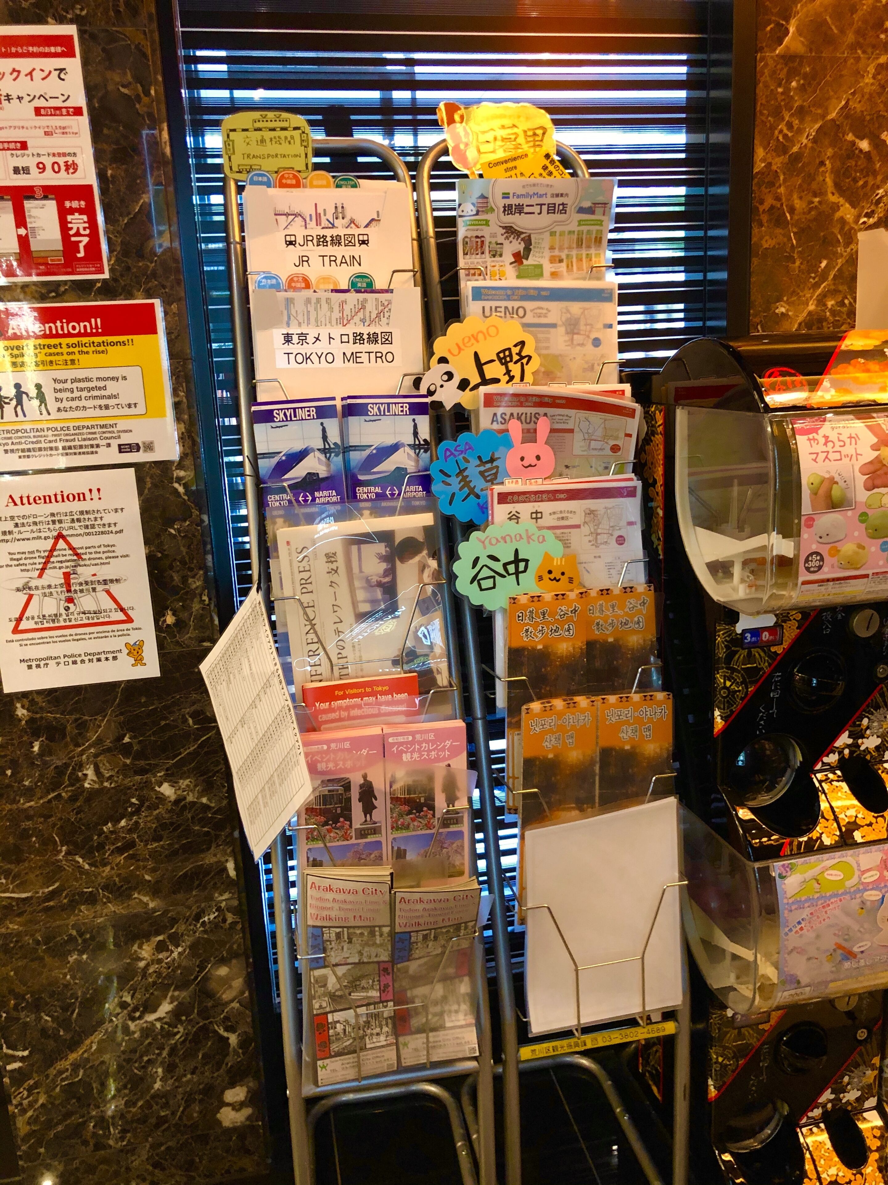 A display of travel maps and information stands with various signs and labels.
