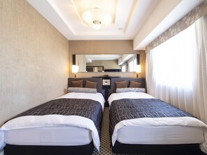 Deluxe Twin kamer, niet-roken | Donsdekens, een bureau, gratis wifi, beddengoed