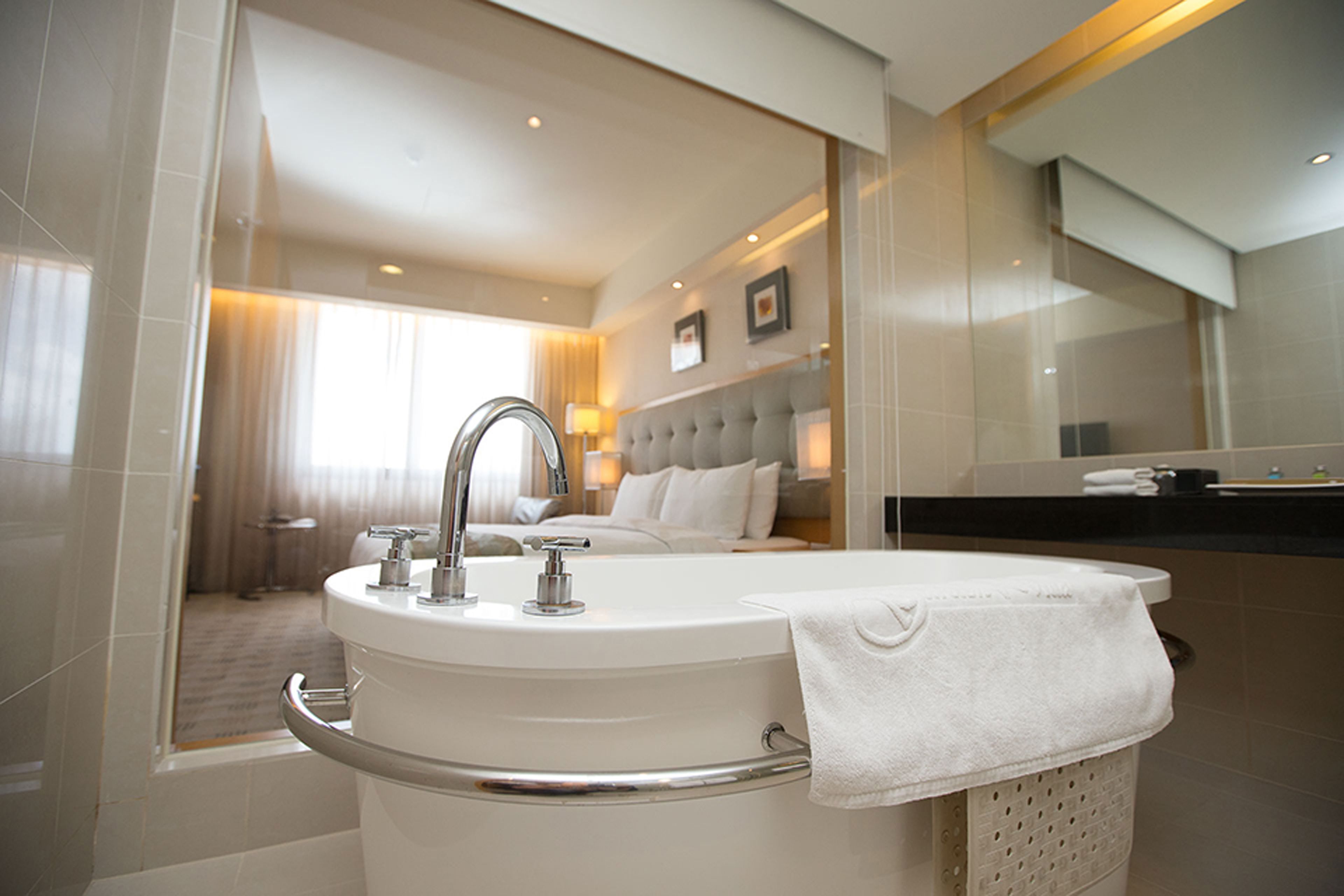 deluxe quadruple room, multiple beds | deep-soaking bathtub