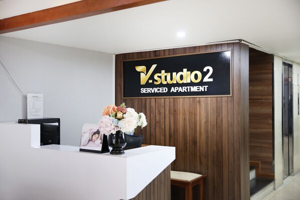 A reception desk with a sign reading "Studio 2 Serviced Apartment." - V-studio Hotel Apartment 2 (Hanoi)