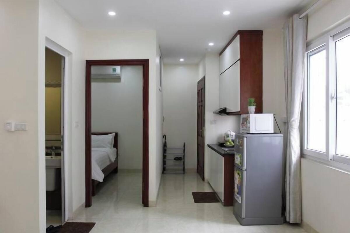 Premium bedding, desk, laptop workspace, blackout drapes