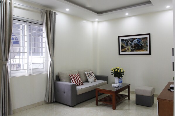 Luxury Apartment, 1 Bedroom | Living room | Flat-screen TV