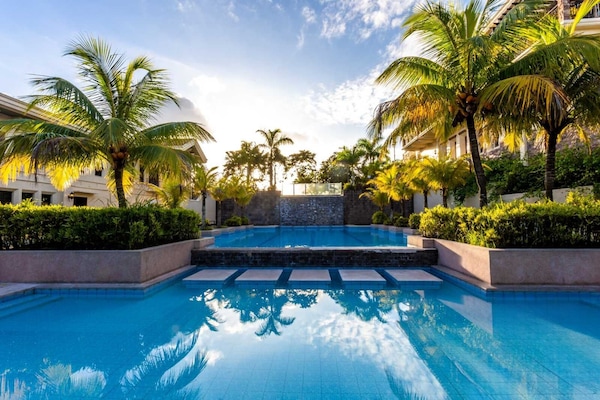 Outdoor pool, pool umbrellas, sun loungers