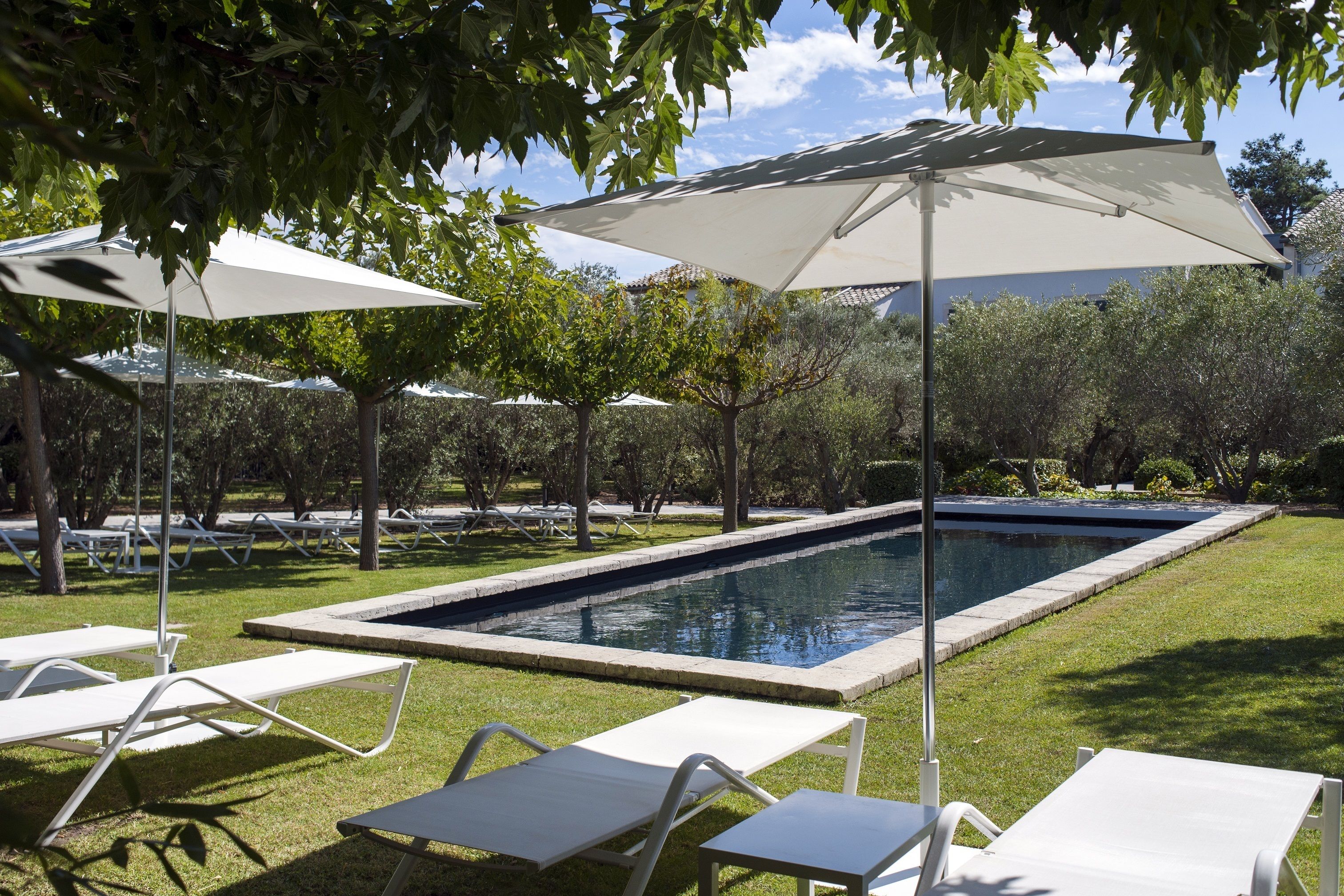 outdoor pool, pool umbrellas, pool loungers