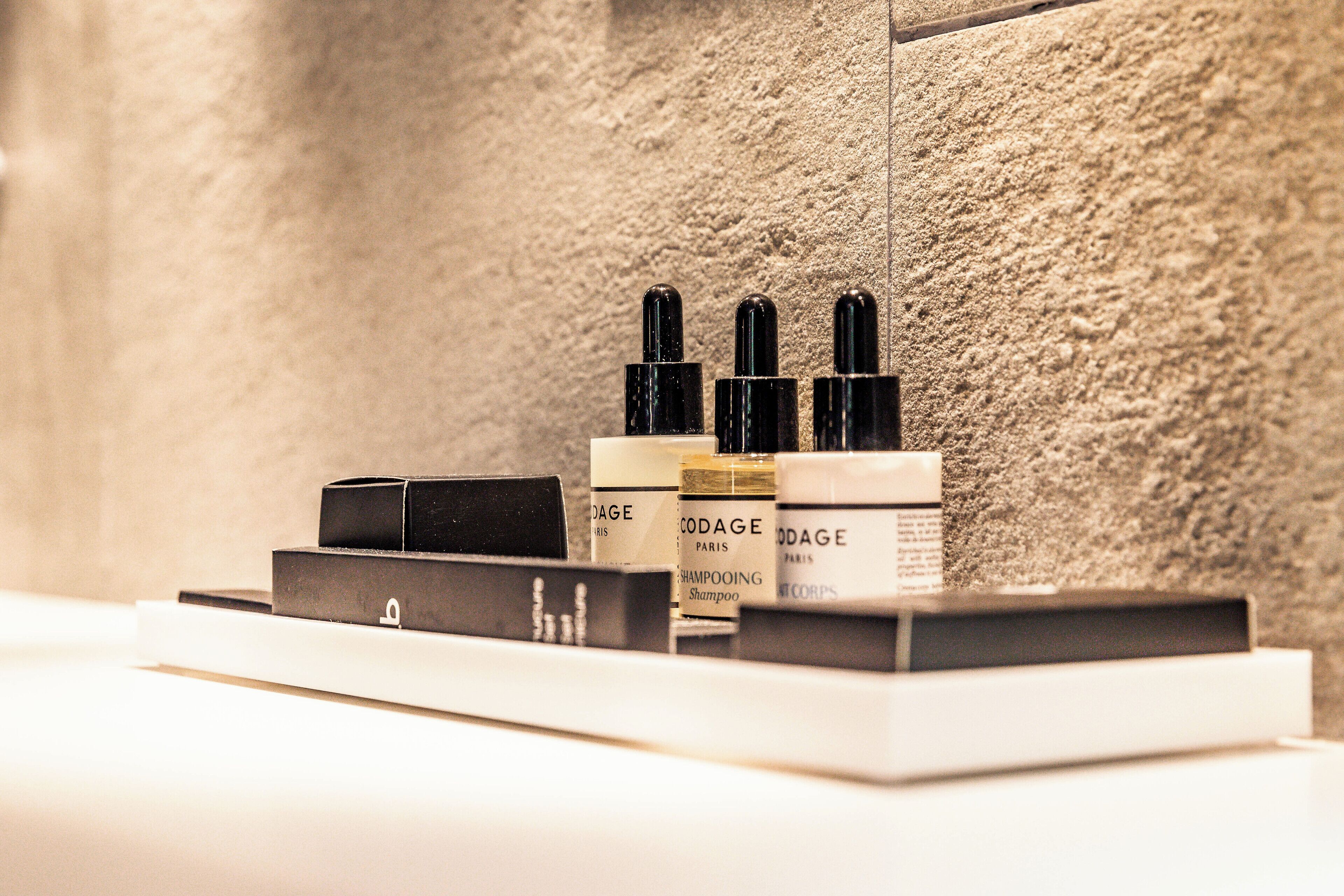 combined shower/bathtub, designer toiletries, hair dryer, bathrobes