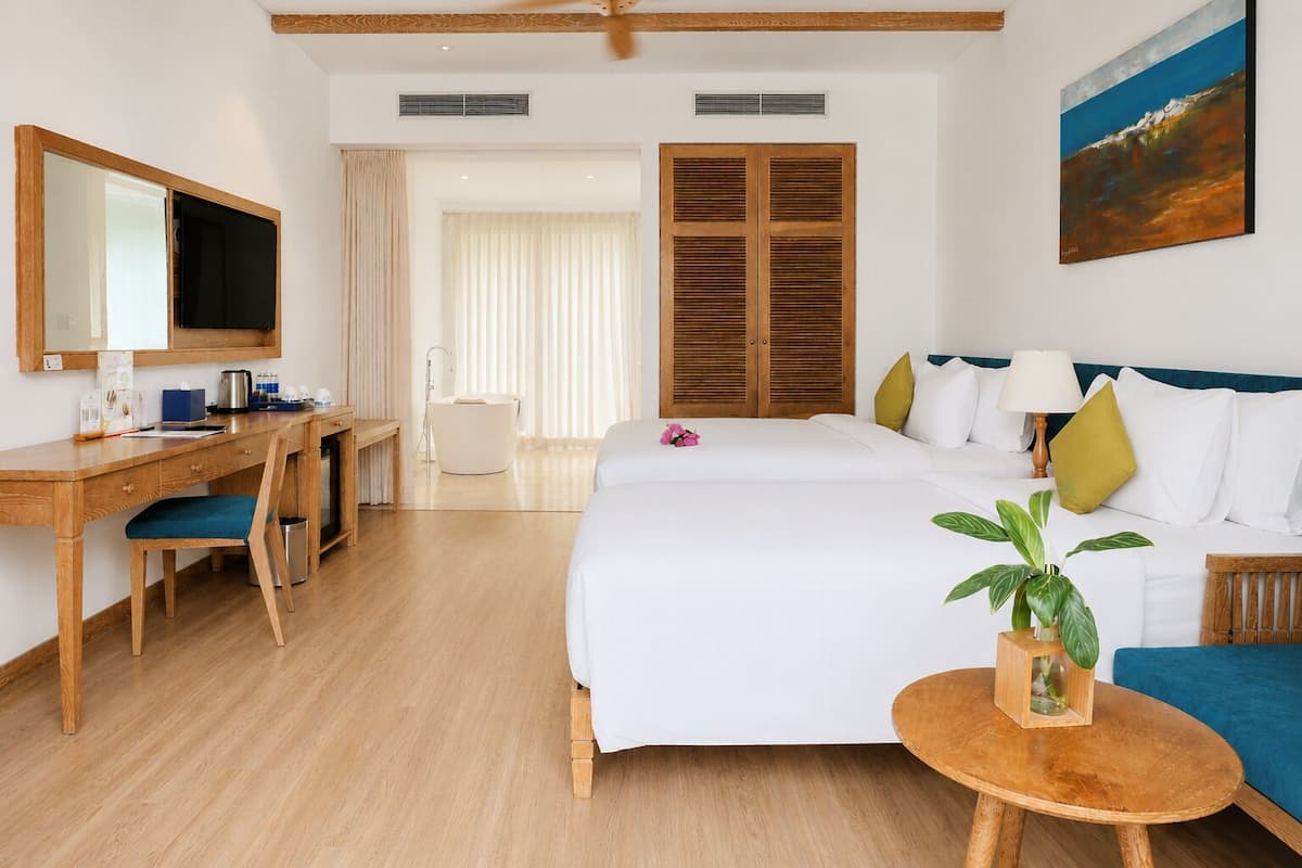 Junior Triple Room, Balcony, Pool View | Premium bedding, minibar, in-room safe, desk