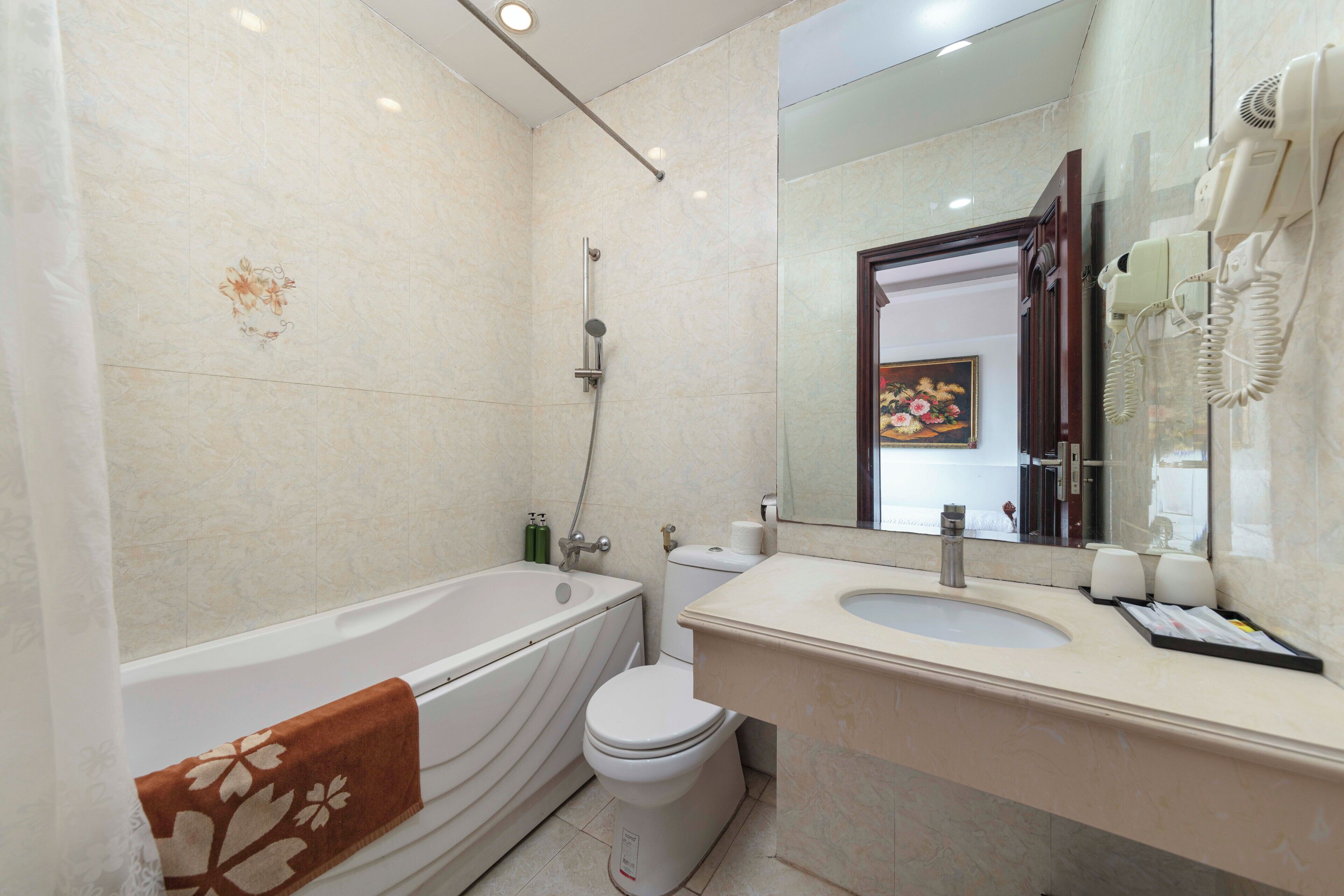 free toiletries, hair dryer, slippers, bidet