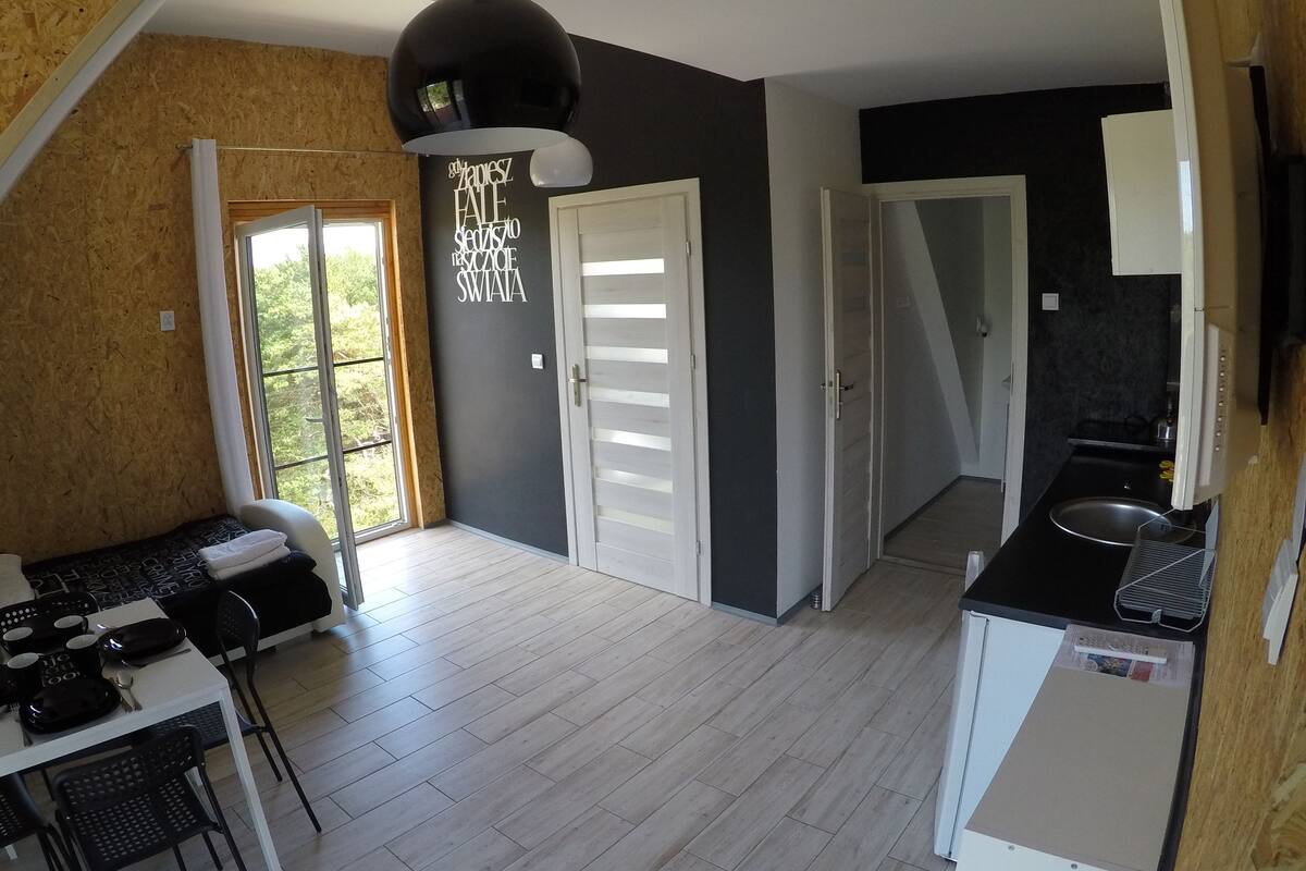 Habitación cuádruple, Terraza, vista al mar (two extra beds possible) | Área de sala de estar | Televisión LCD